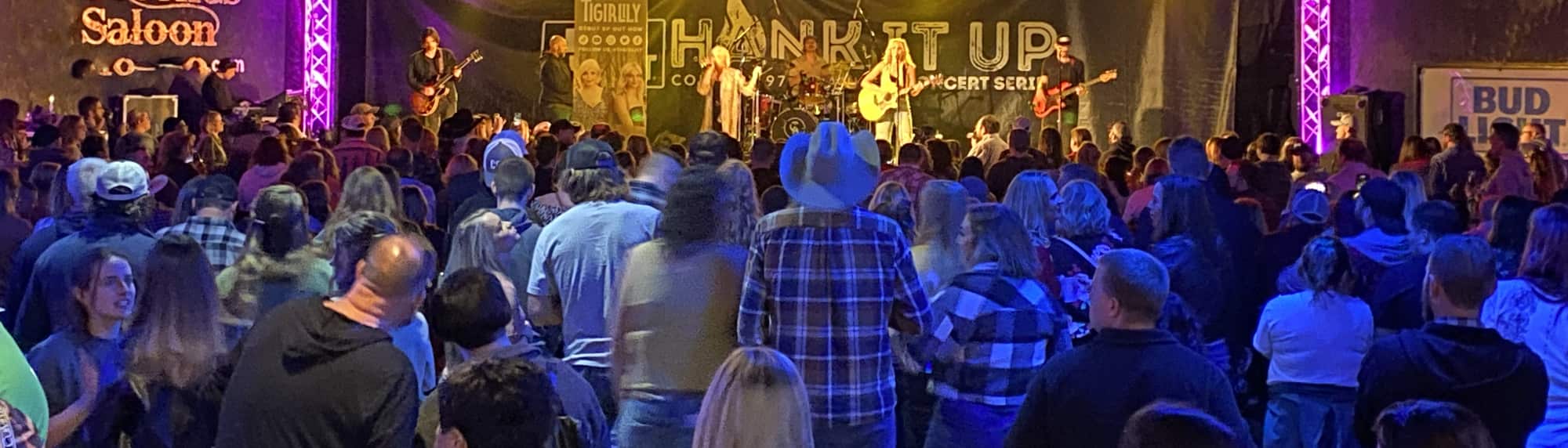 country concert with fans wearing cowboy hats Morgantown